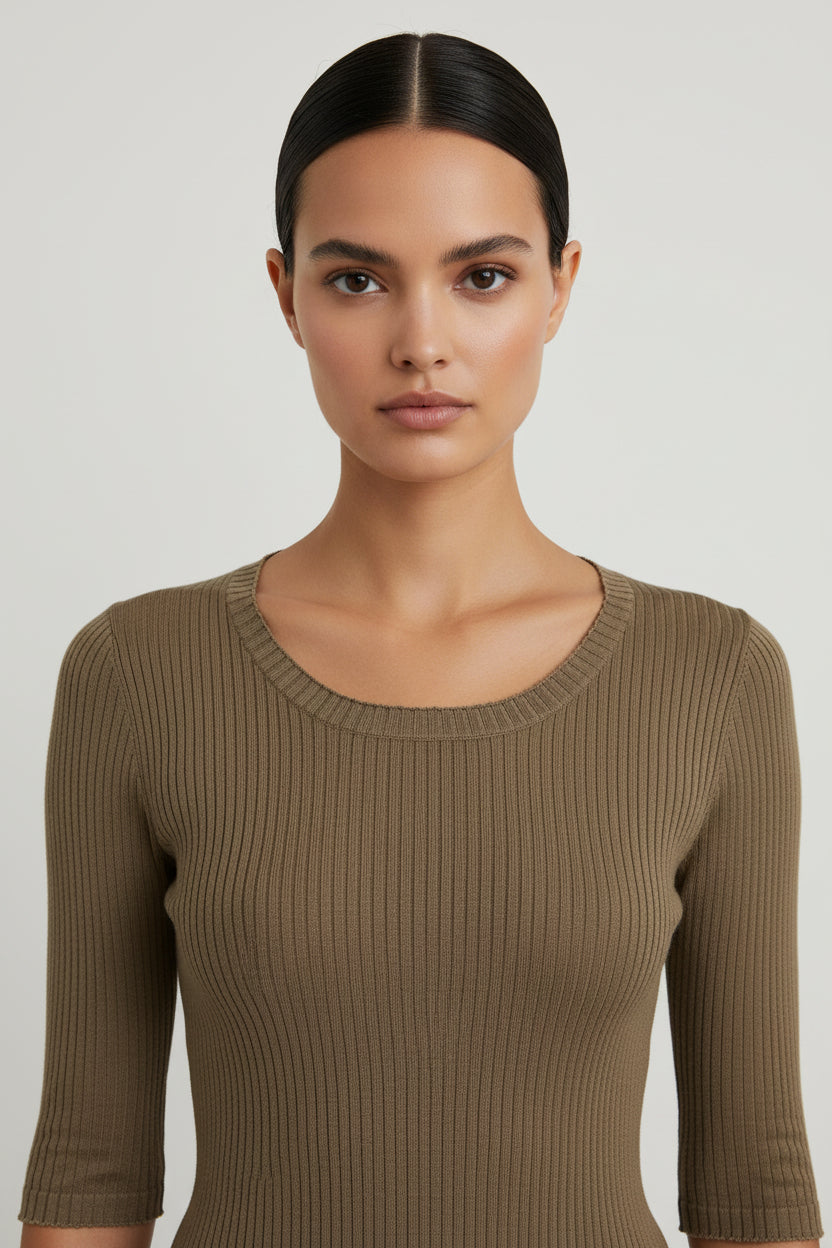 Mannequin wearing a brown ribbed sweater and pants against a plain background