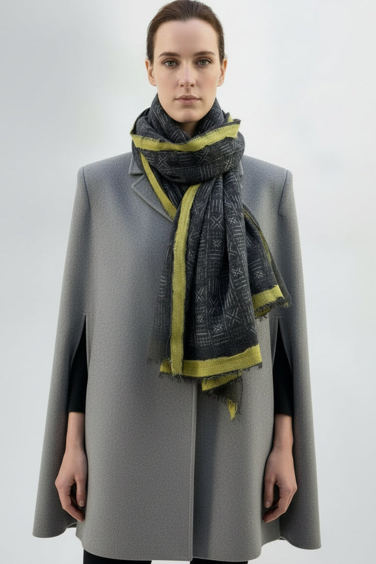 model in an ethnic print grey scarf with yellow border