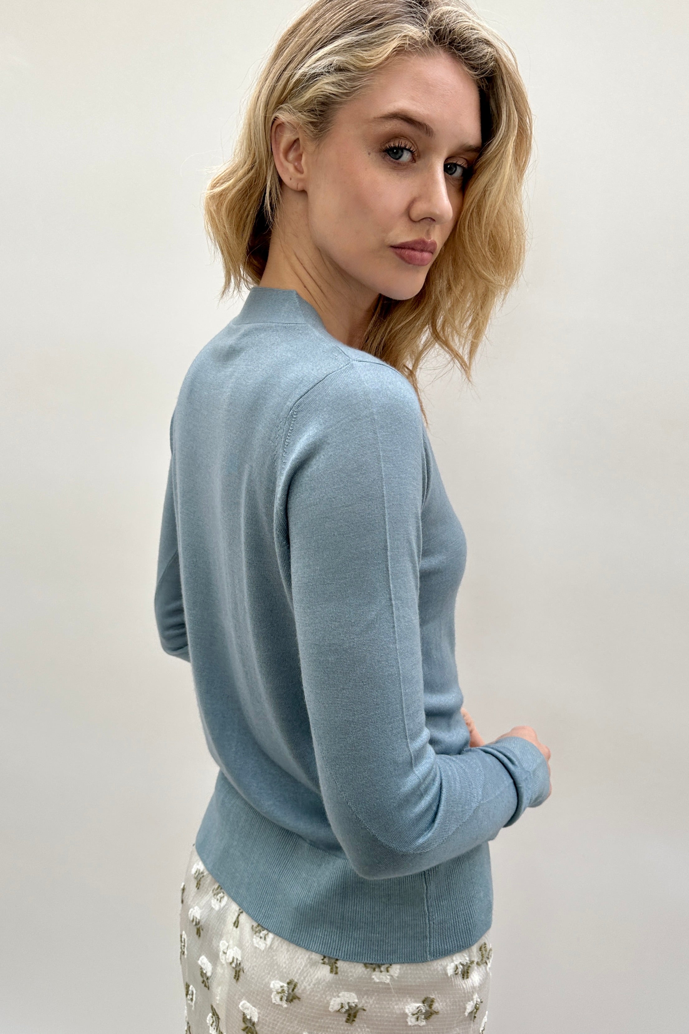 maeser light blue teal v neck
cardigan cashmere silk twisted sleeves back view