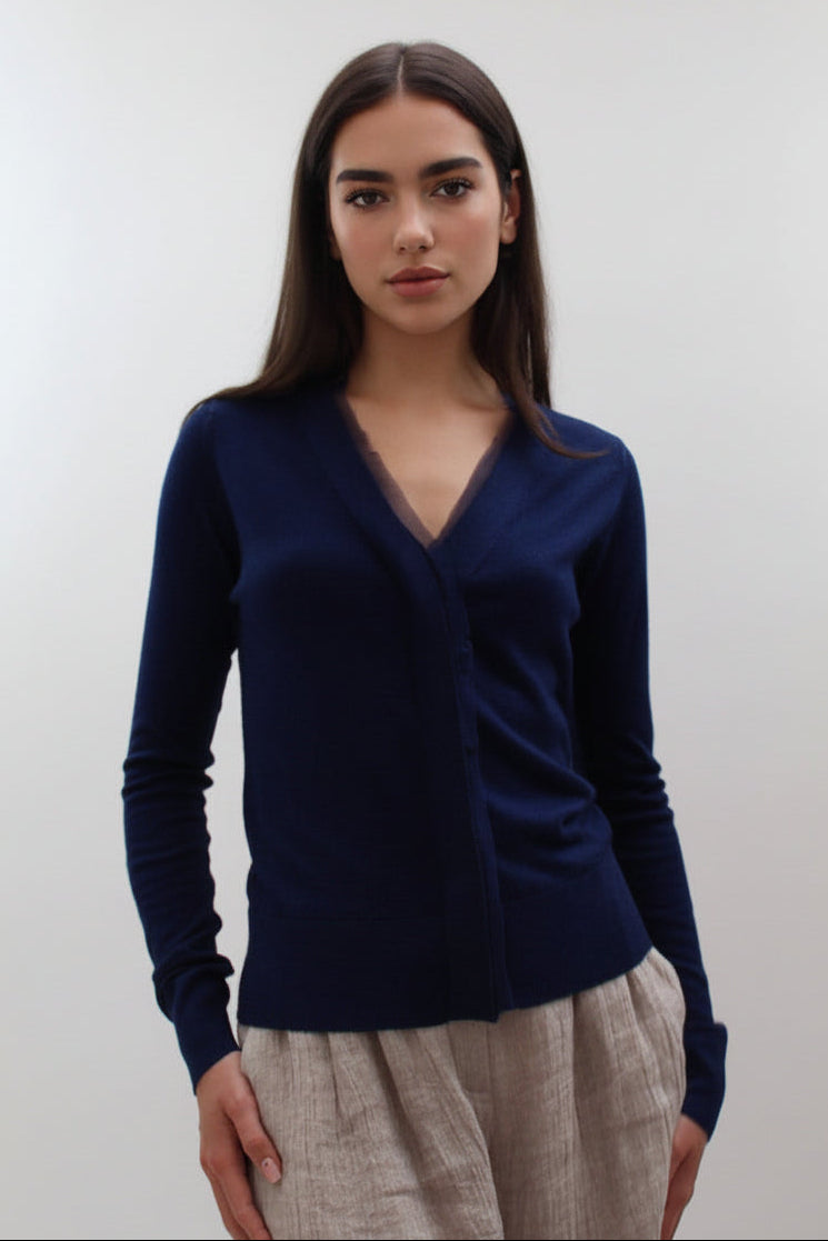 model wearing navy v neck Moby cardigan with chiffon silk neck trim