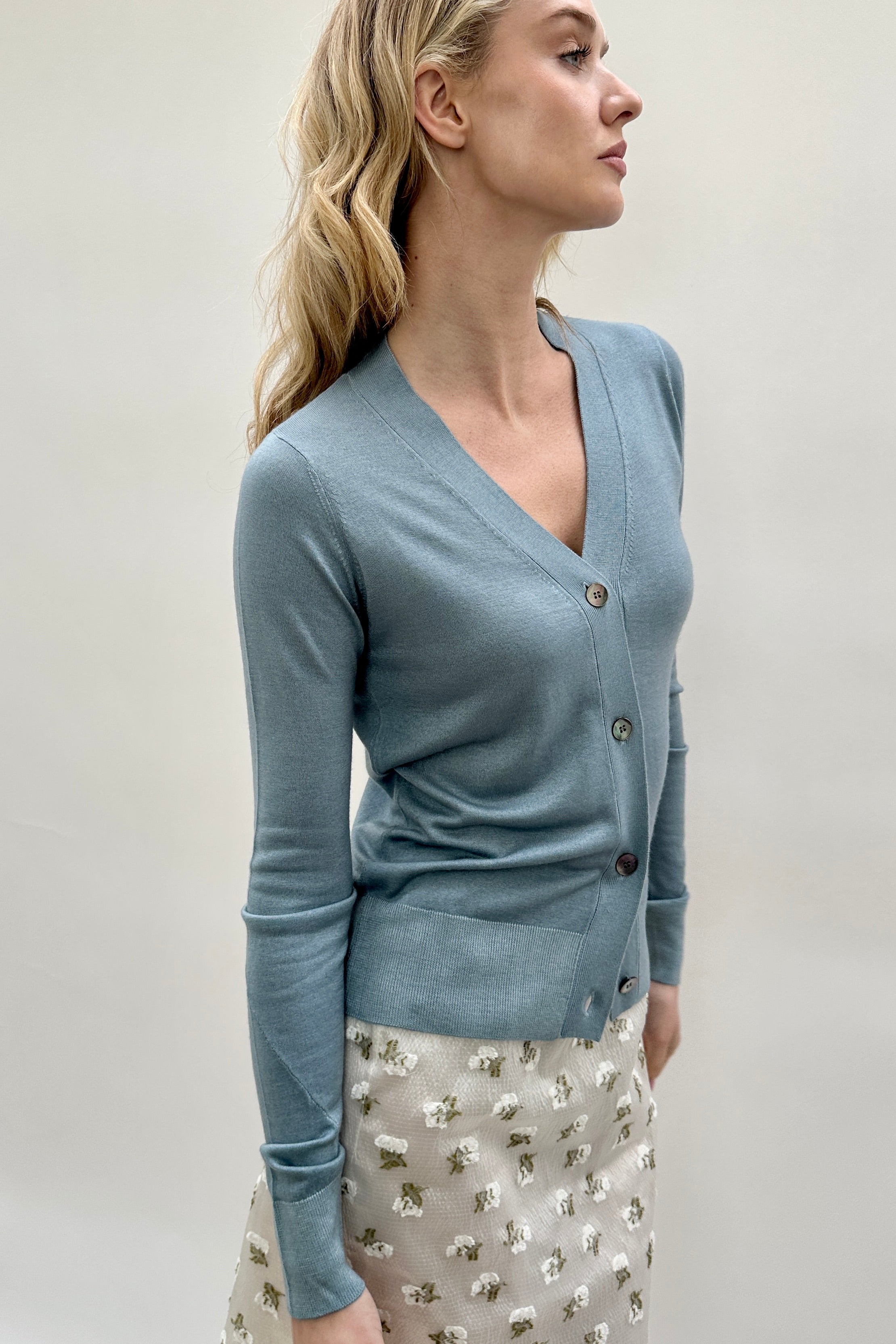 maeser light blue teal v neck
cardigan cashmere silk twisted sleeves side view