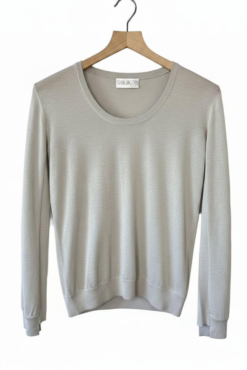 Gray sweater on a wooden hanger against a white background