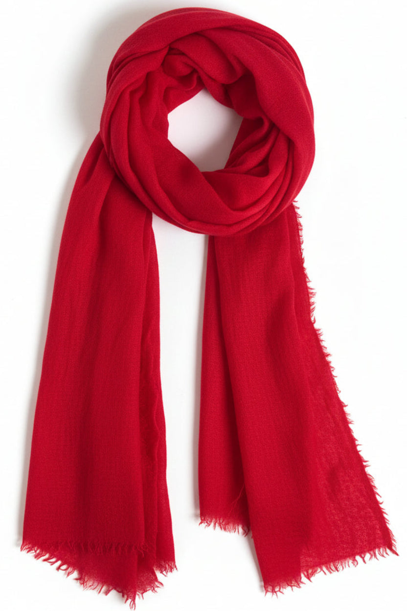 Red scarf on a white surface