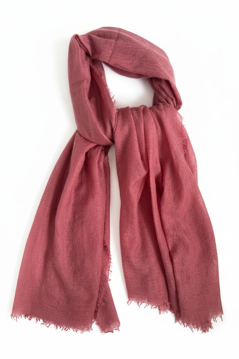Reddish-brown scarf on a white surface