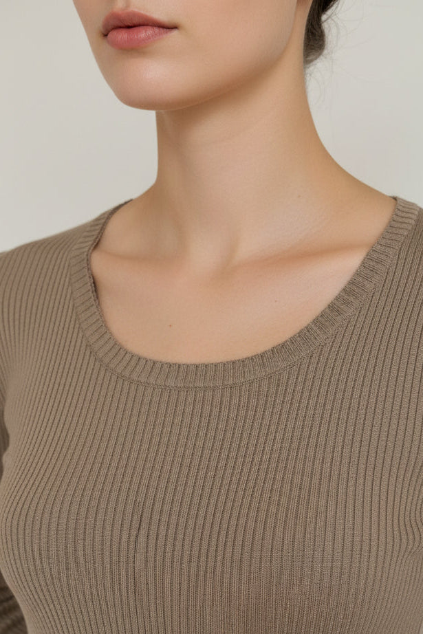 Brown ribbed sweater on a mannequin against a white background