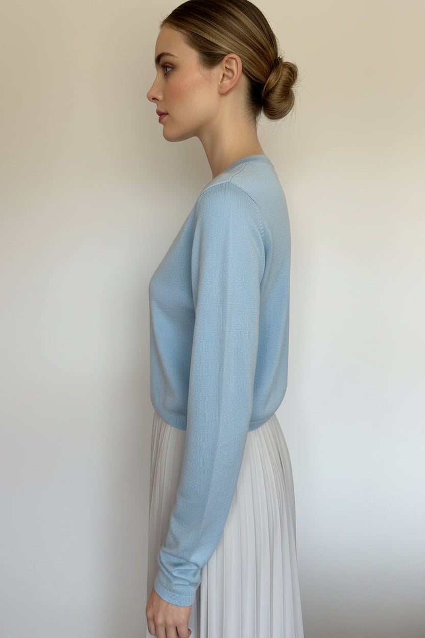 woman with blue cardi side view