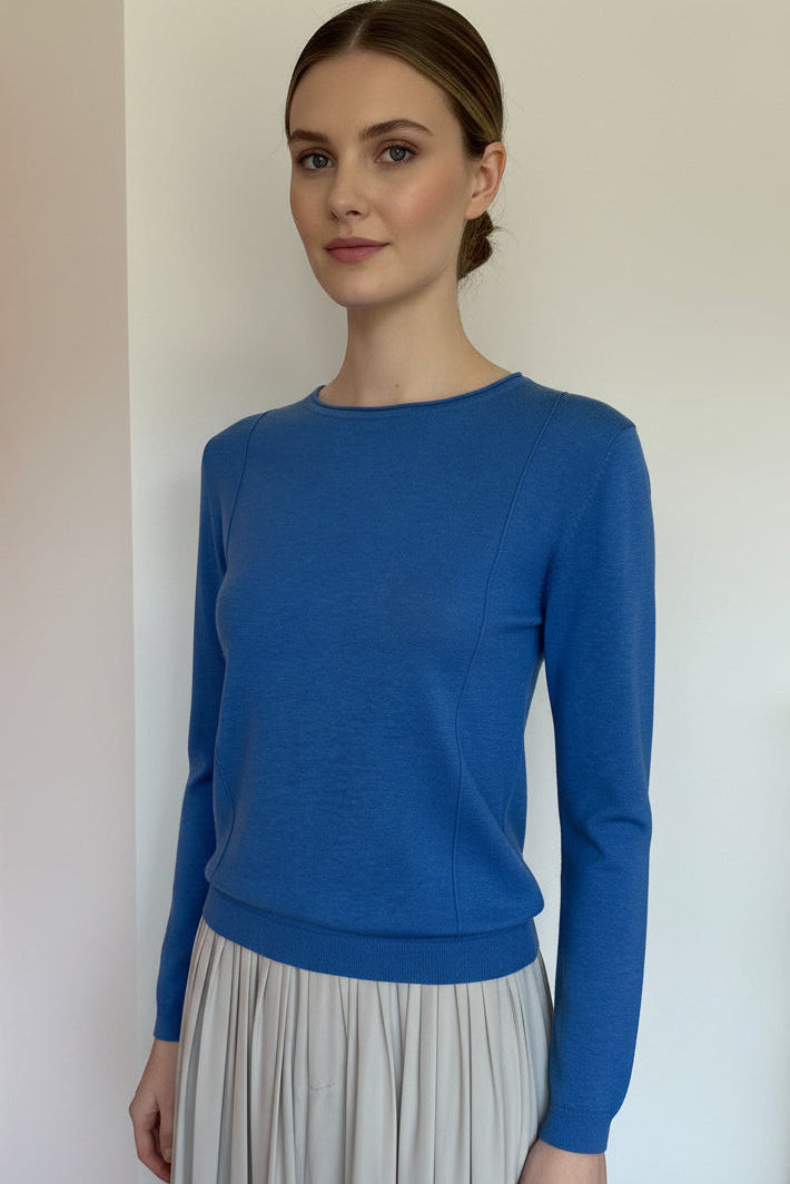 Blue neck pillow on a mannequin with a plain background