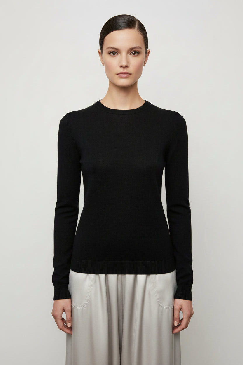 model wearing a black long-sleeve shirt against a plain background