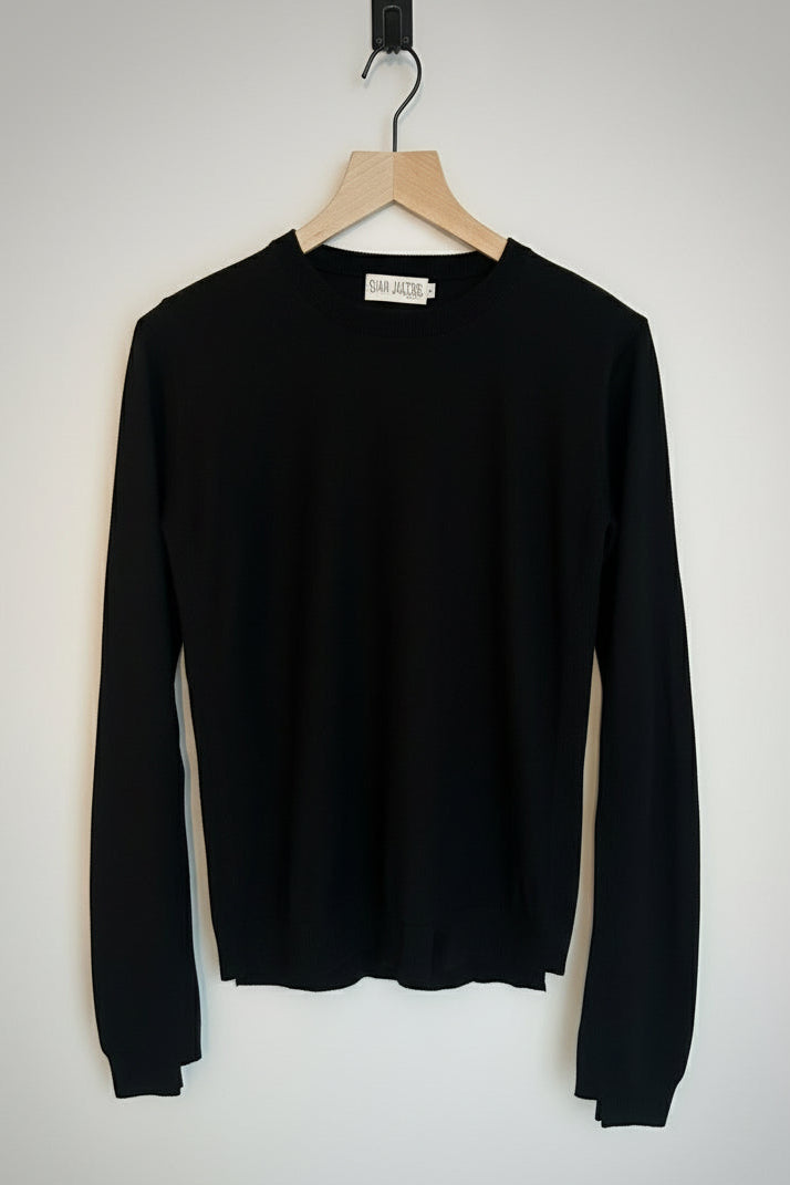 Black long-sleeve Dolly sweater on a white background