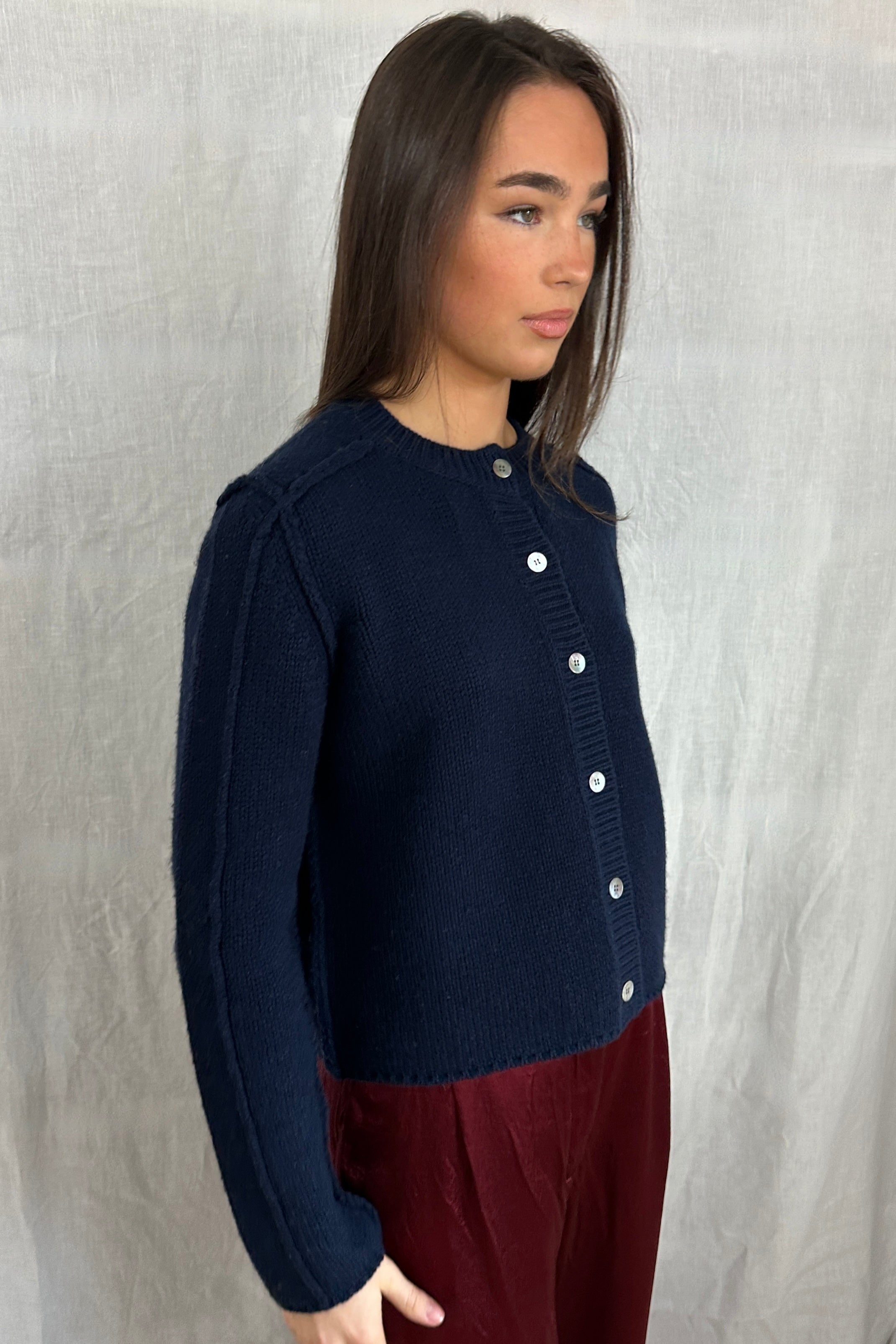 model in janita navy chunky wool mix cardigan side view