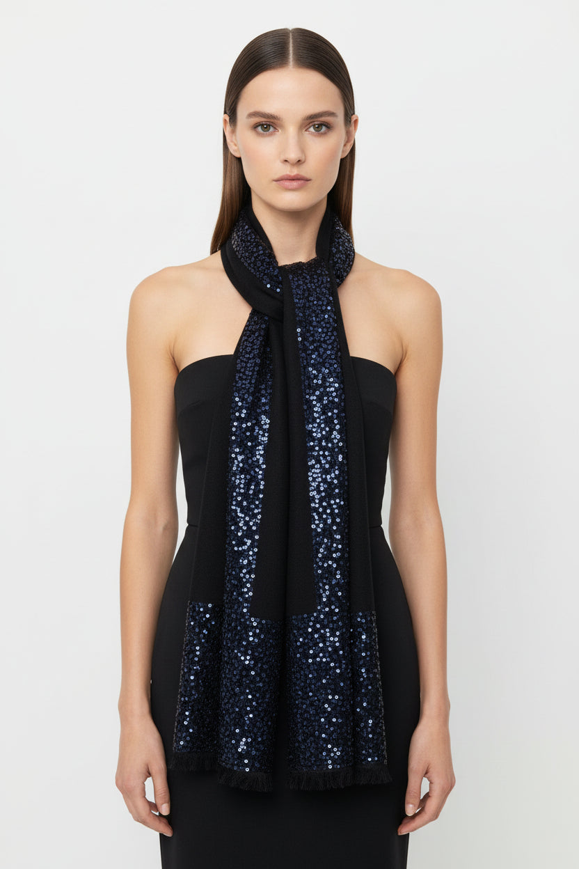 Woman wearing a black sequin scarf on a white background