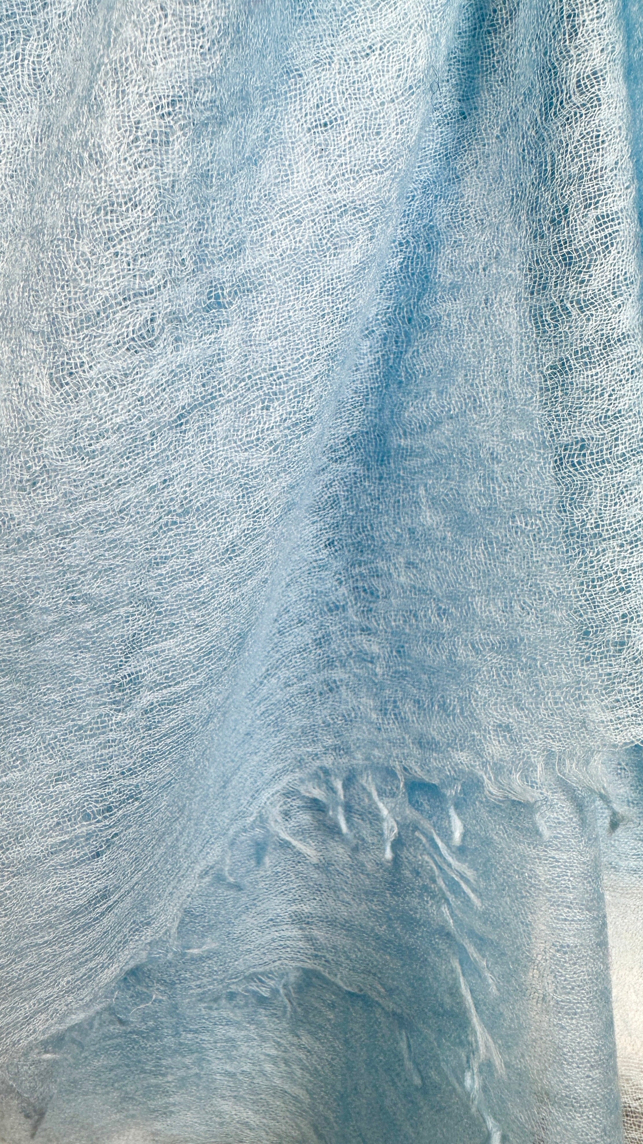 Close-up of marmee light blue scarf