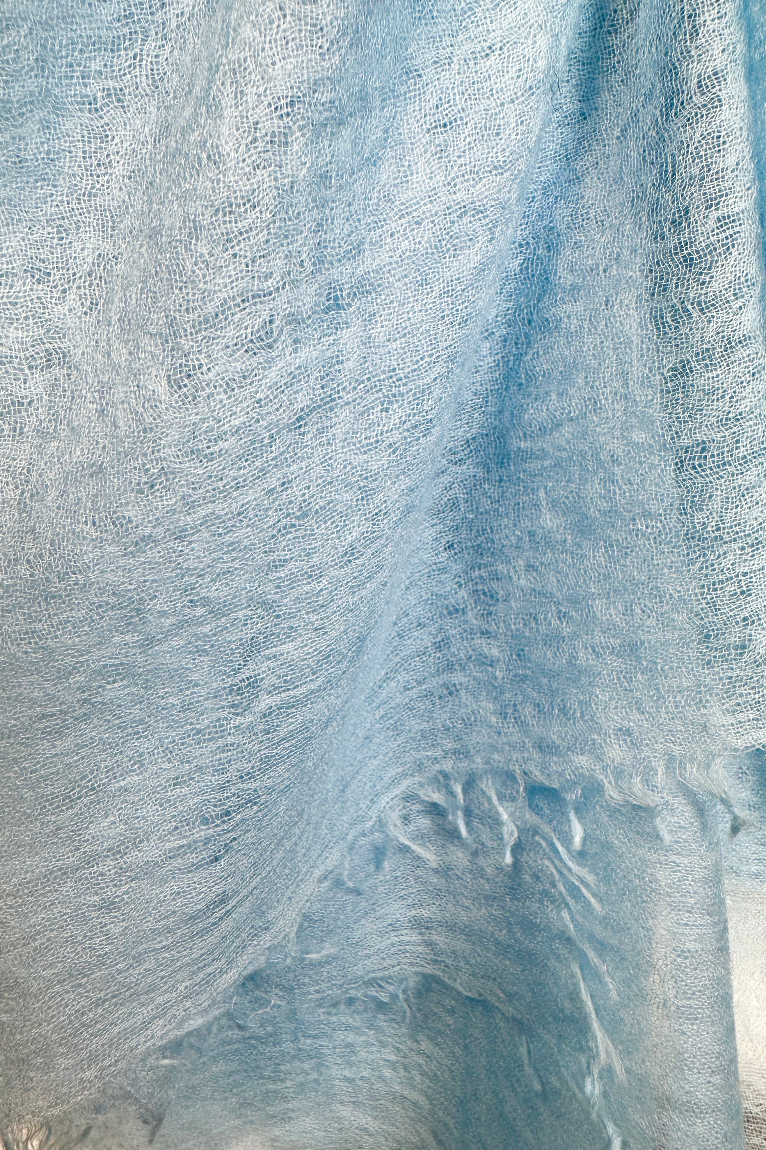Close-up of marmee light blue scarf