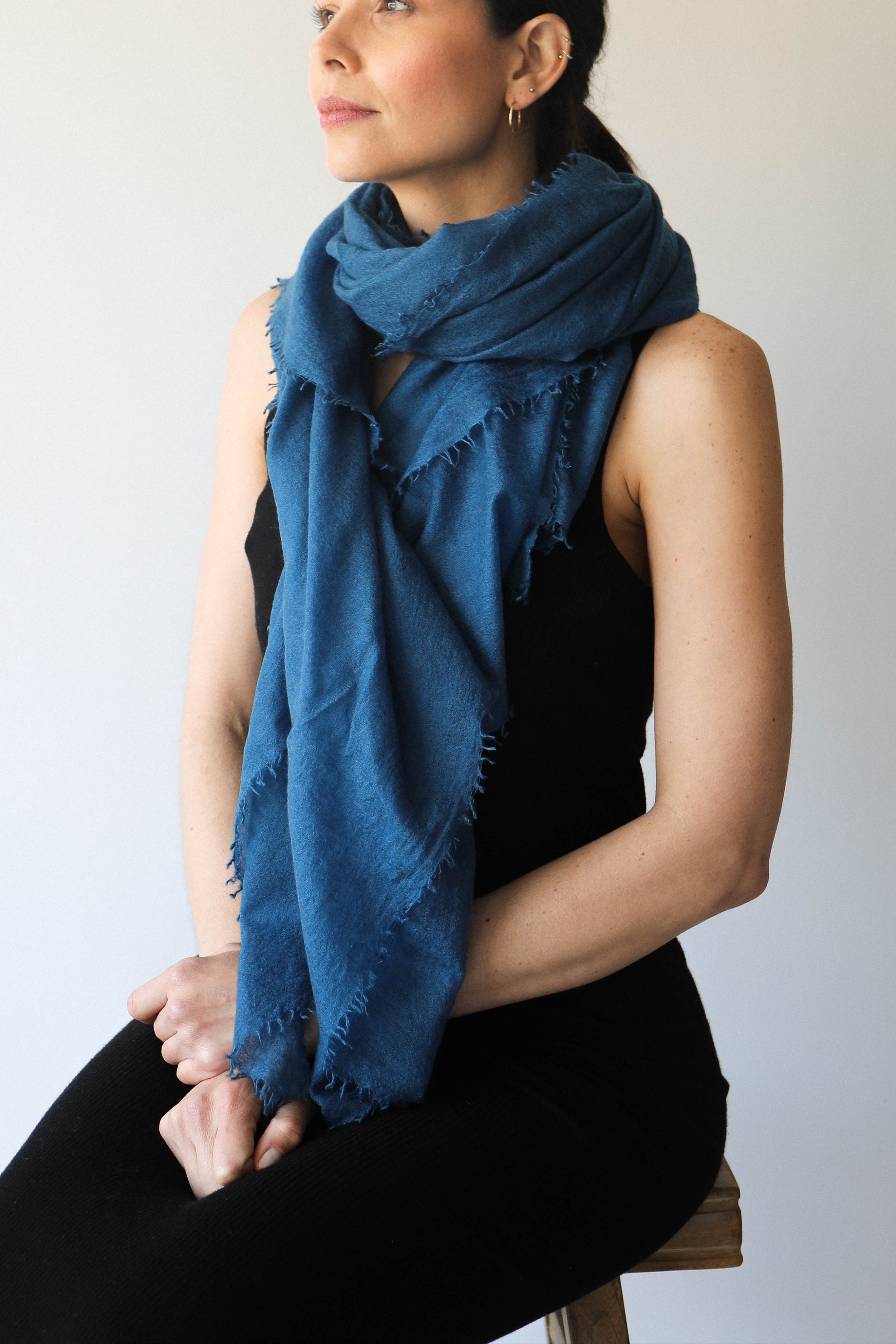 petrol teal blue scarf cashmere on model on stool