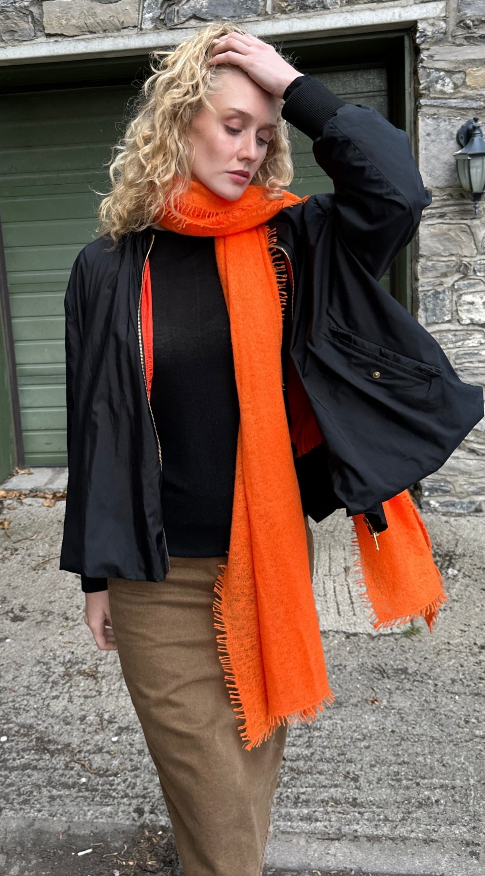 Eighty orange knit cashmere wrap scarf walking