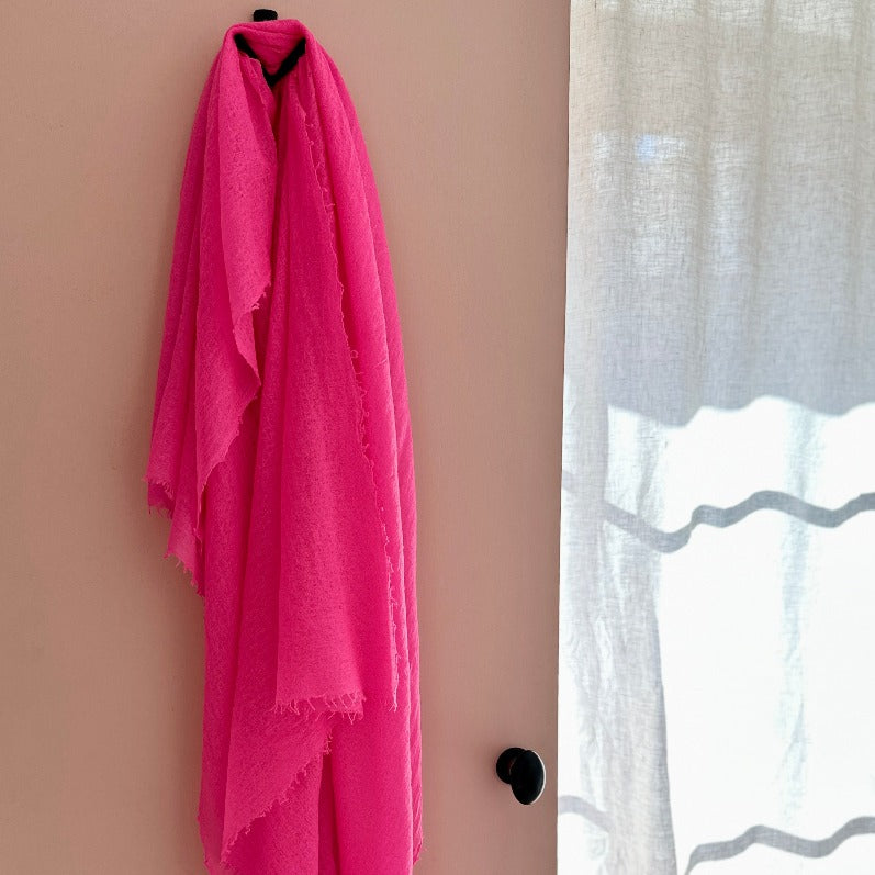 marmee neon pink scarf on door 