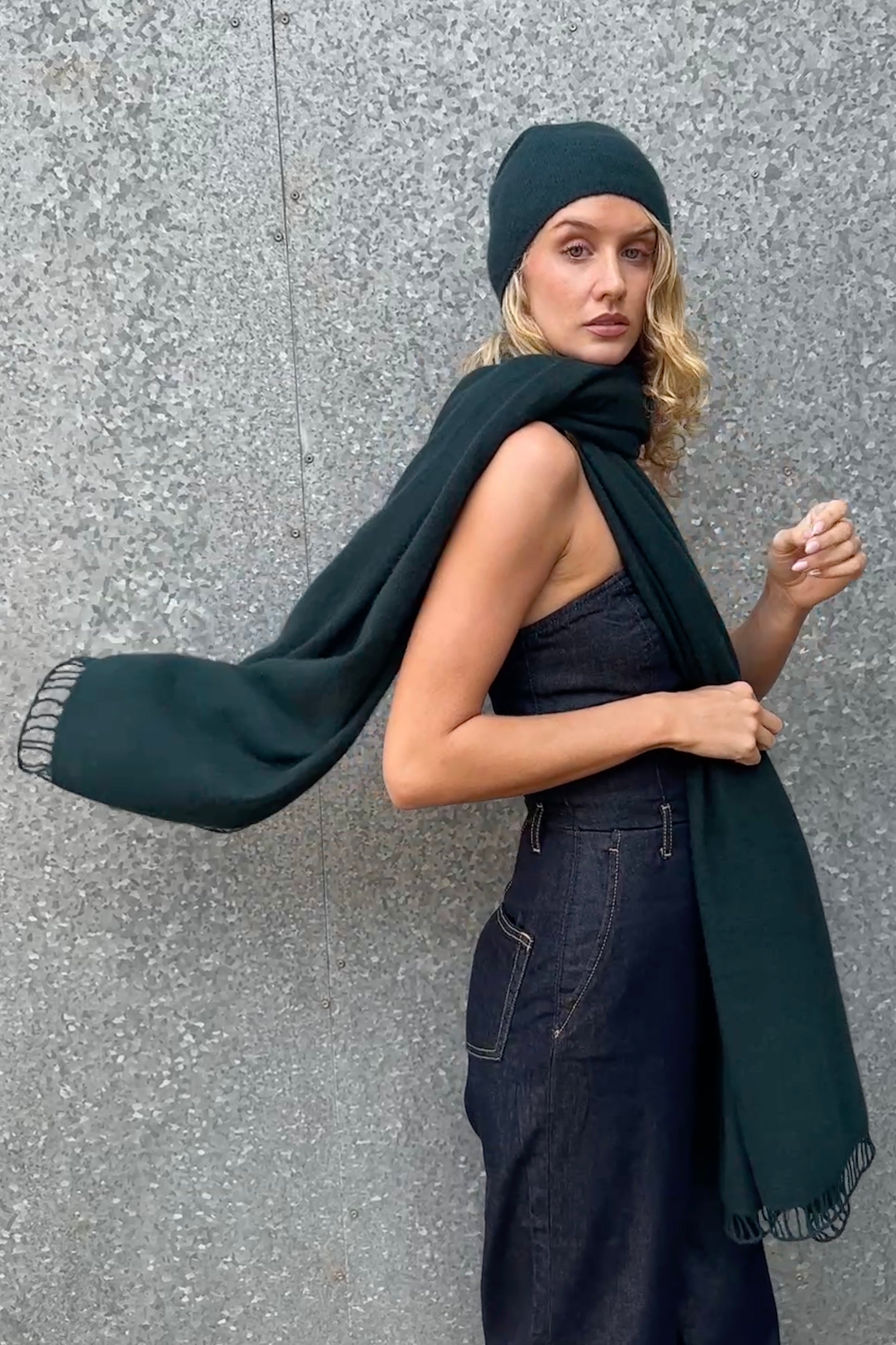 model wearing dark green cashmere scarf and hat