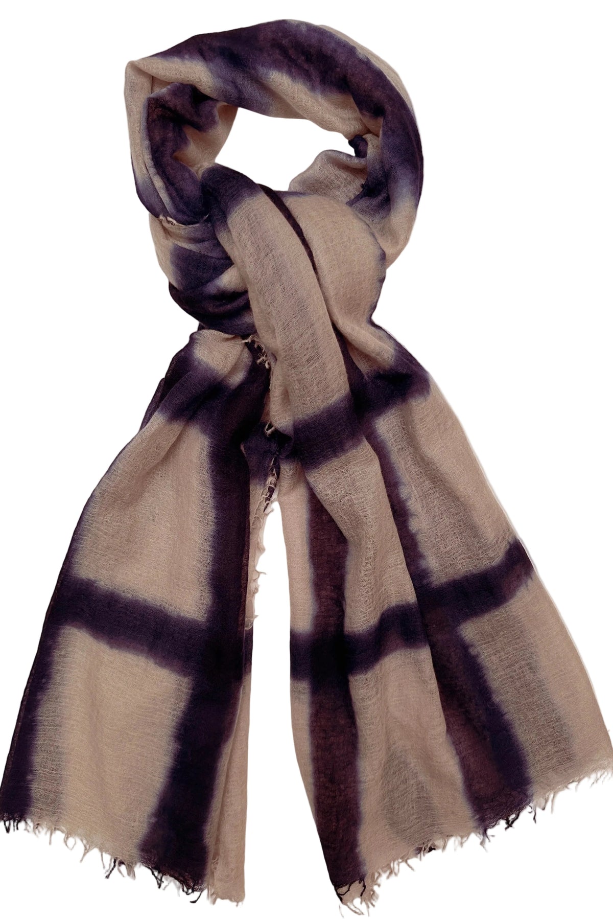 A lightweight scarf with a beige base and dark purple tie-dye plaid pattern, styled in a loop on a plain white background.