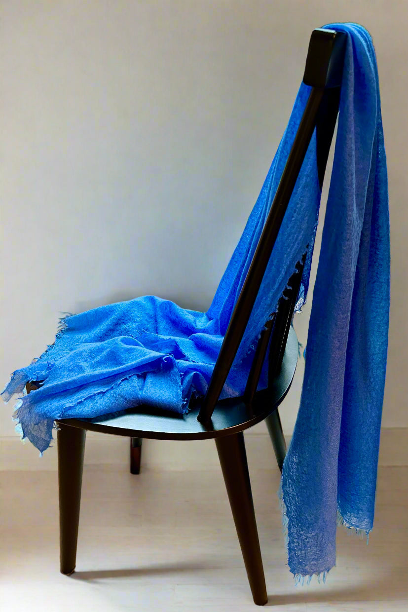 marmee cornflower cashmere scarf on a chair