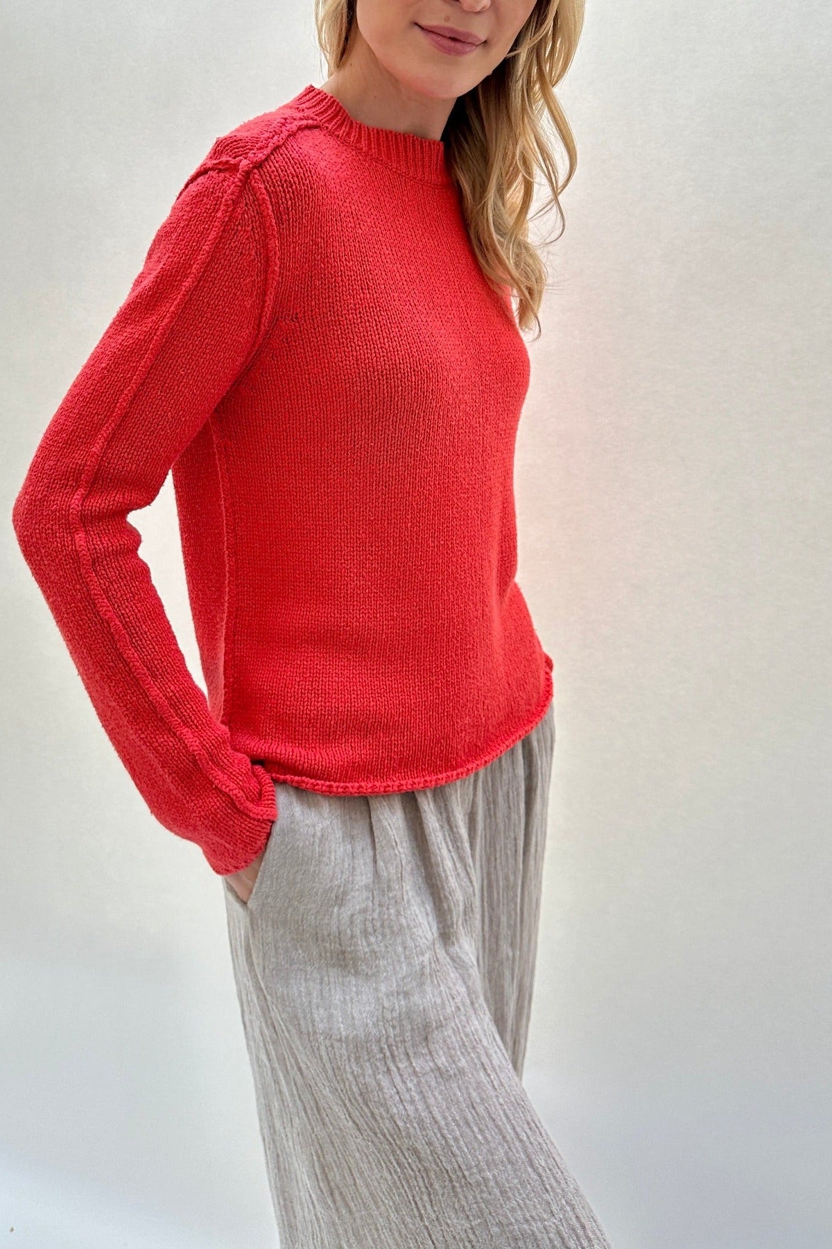 jane geranio side view red sweater