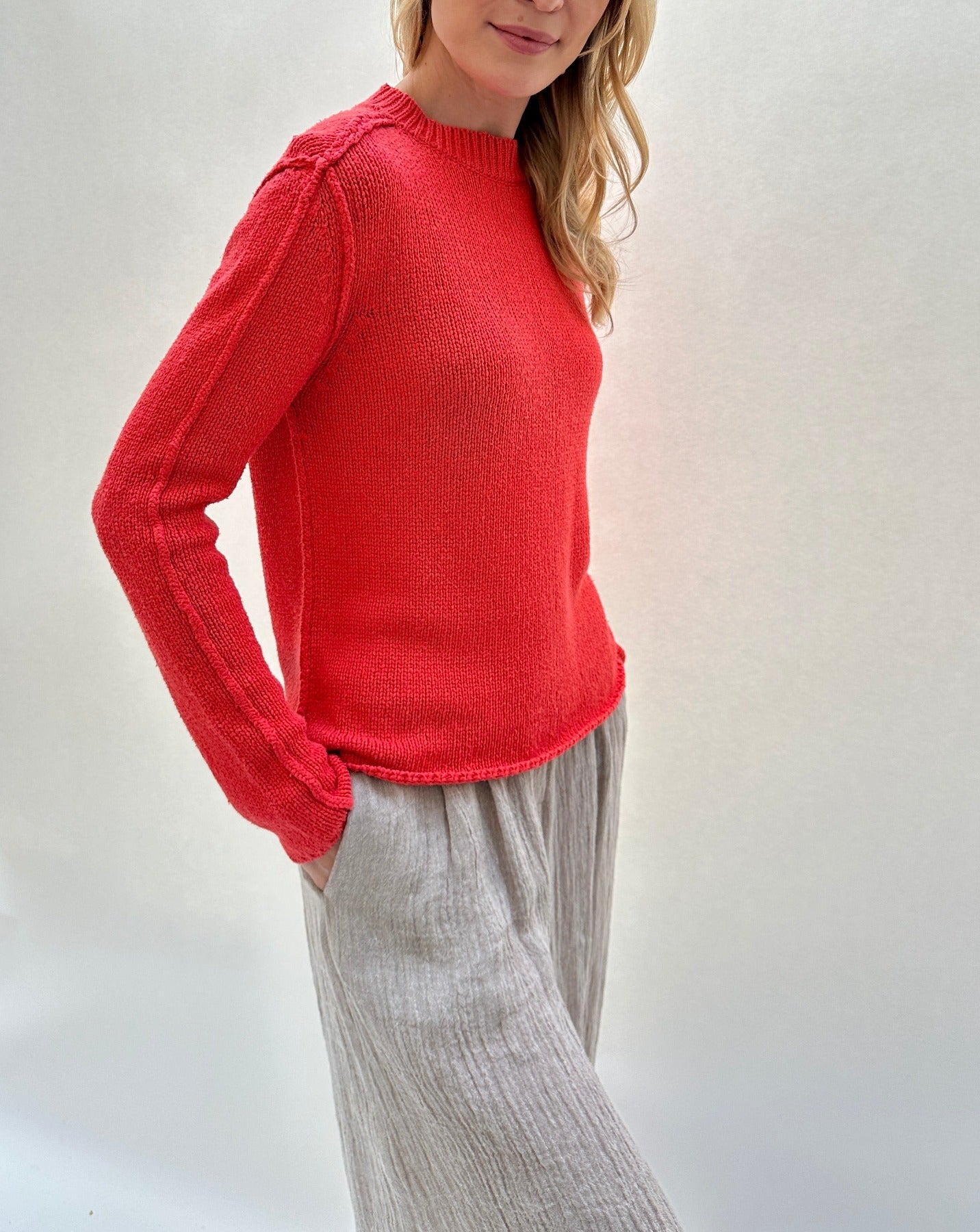 jane geranio side view red sweater