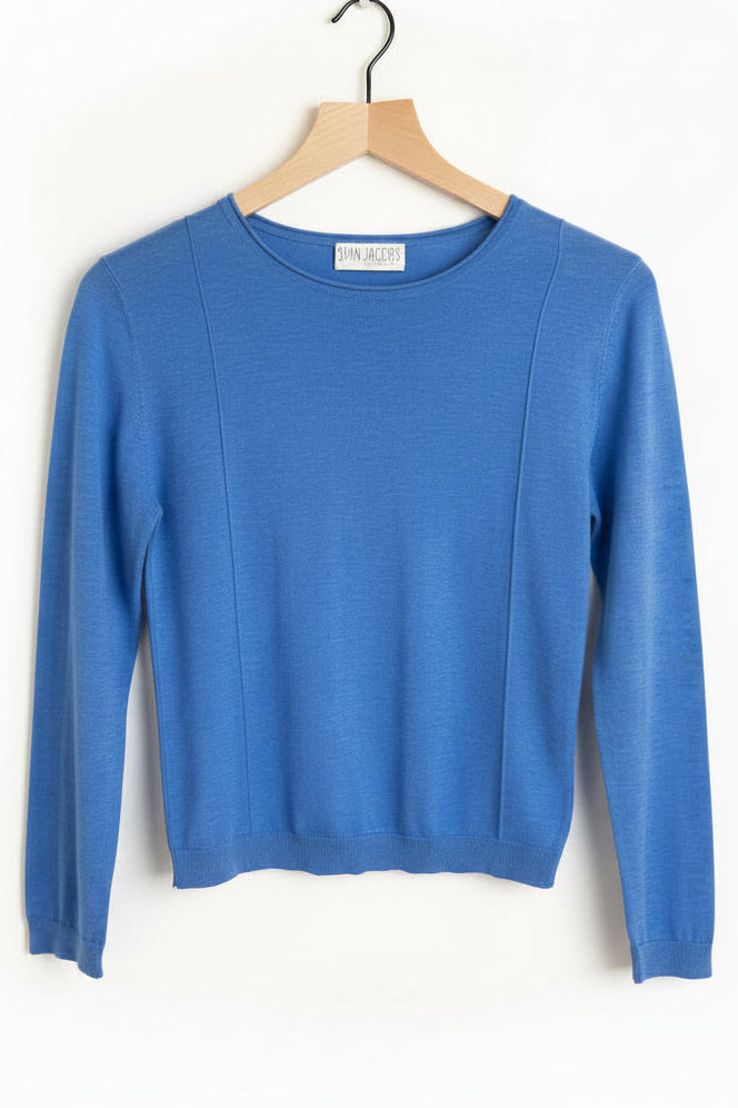 Blue sweater on a wooden hanger against a white background