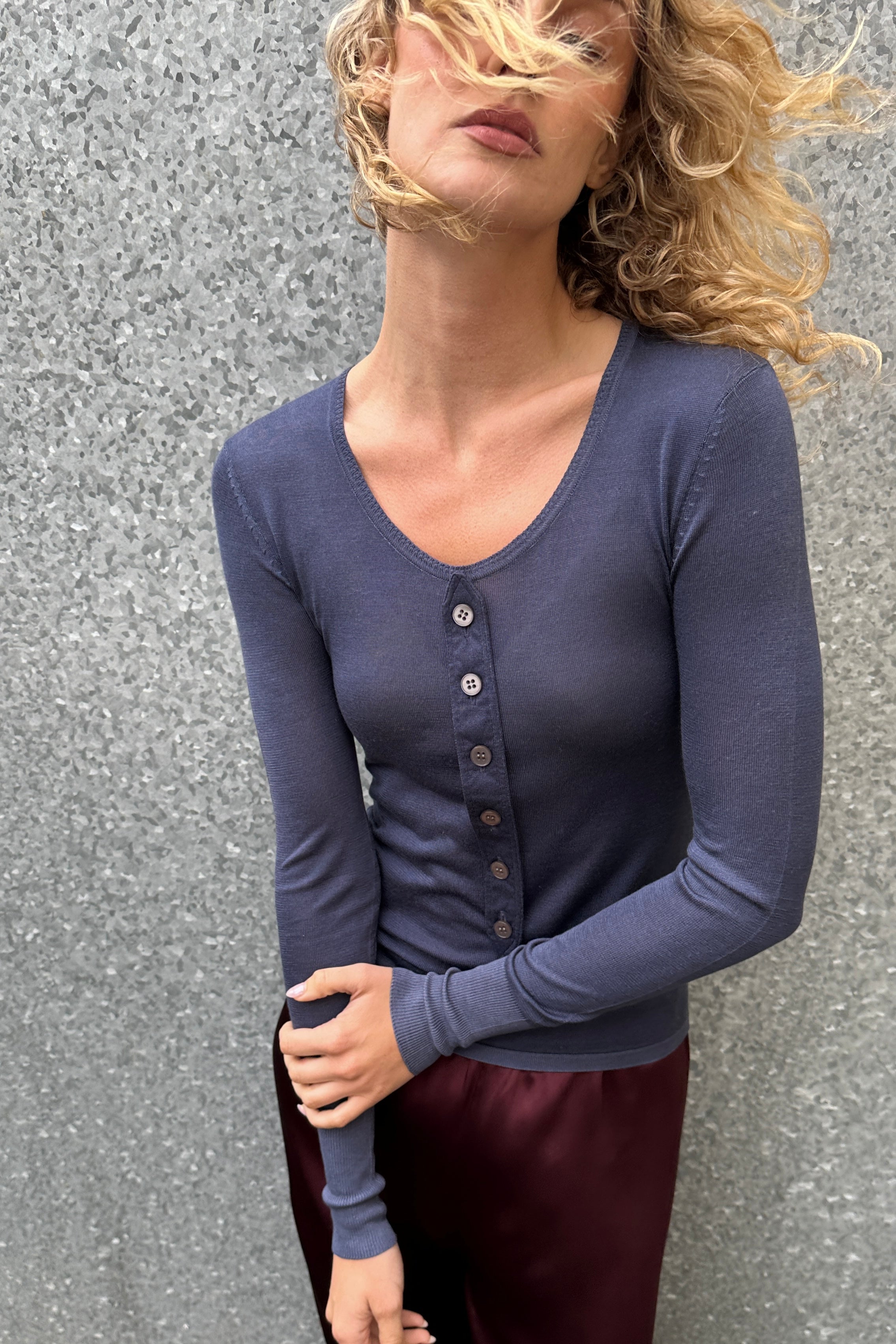 model in bluesy blue scoop button placket silk top 