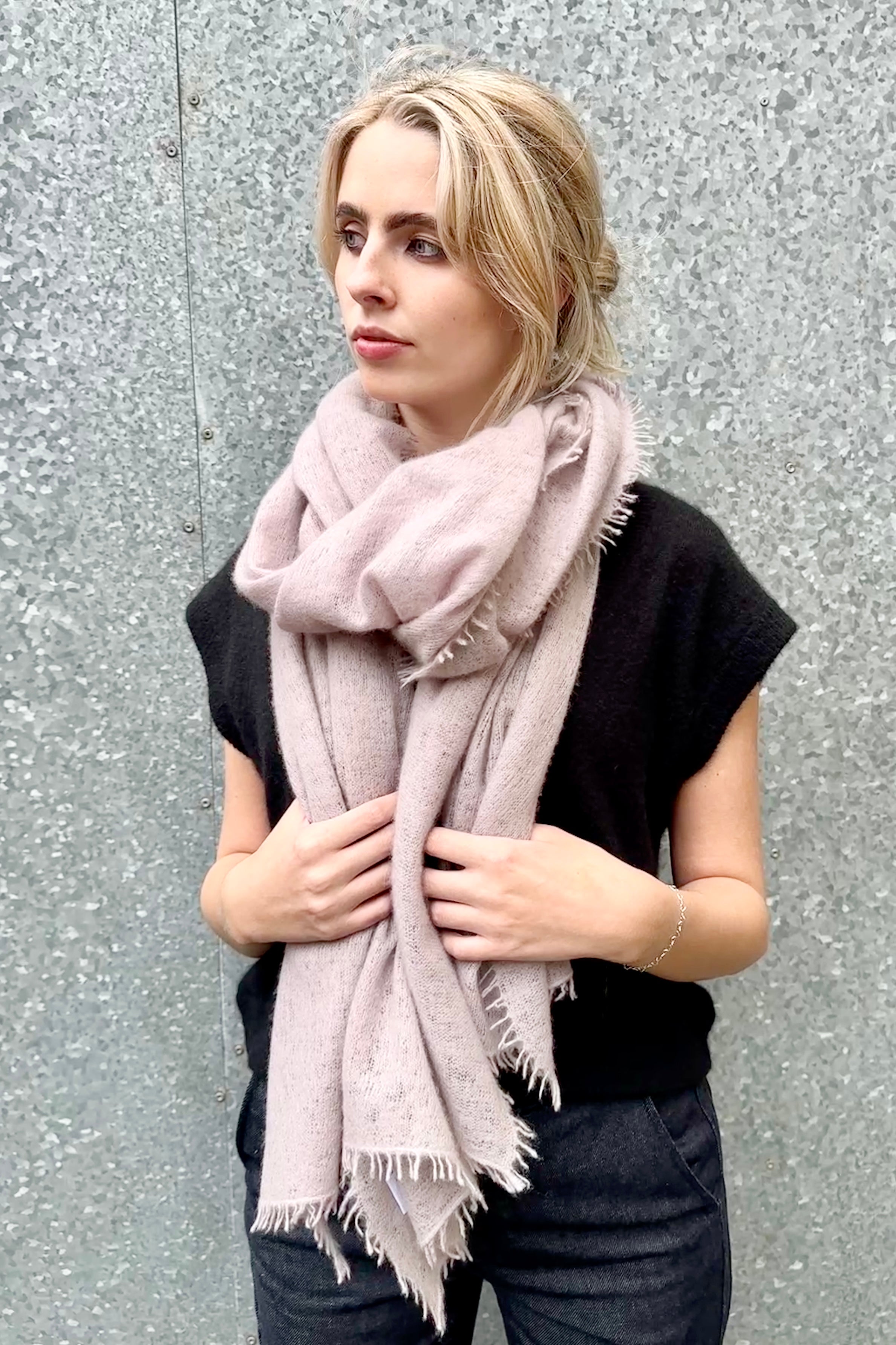 eighty scarf shell grey gray pink against a silver wall