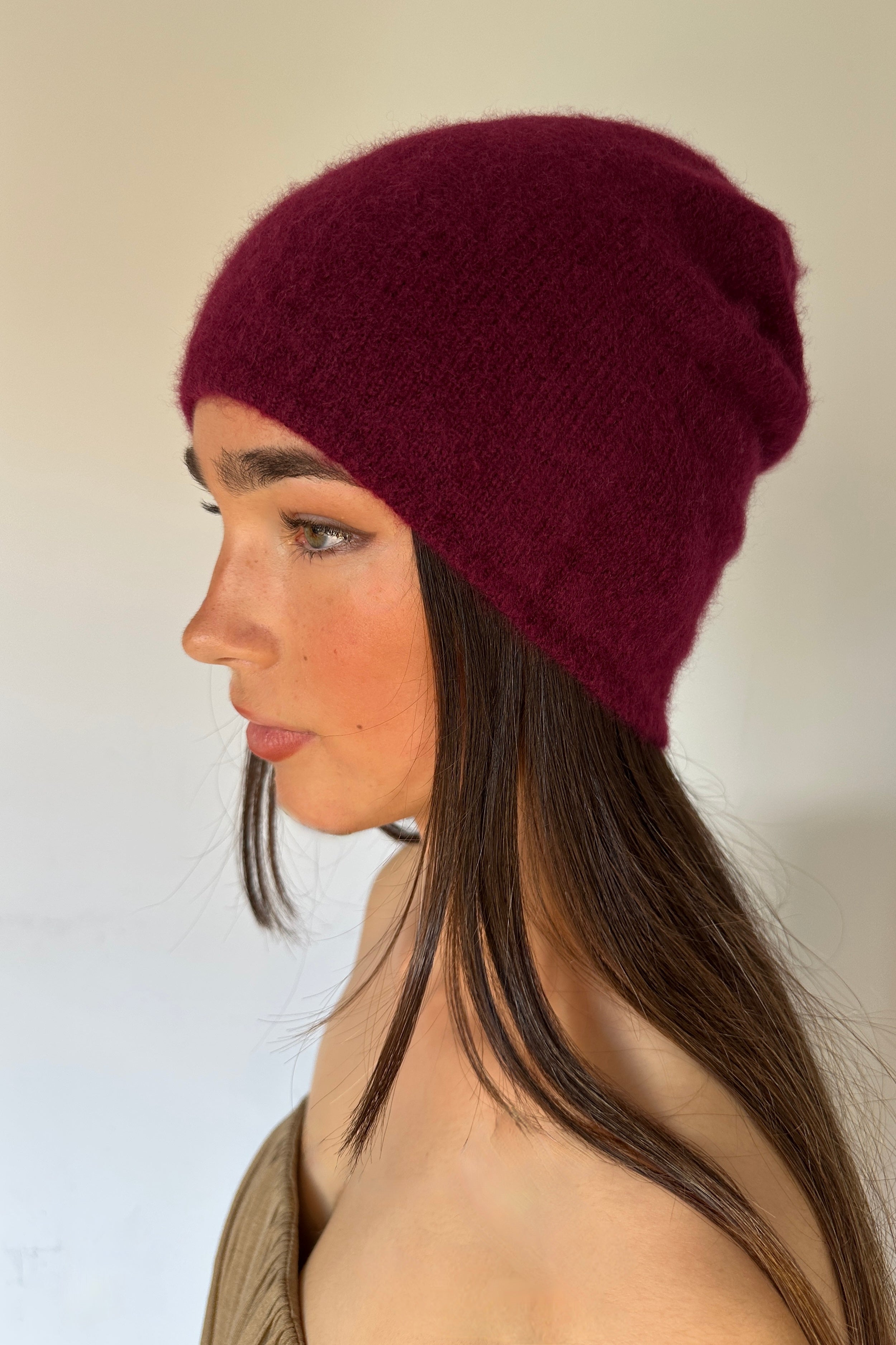 model in beanie cashmere hat in burgundy wine