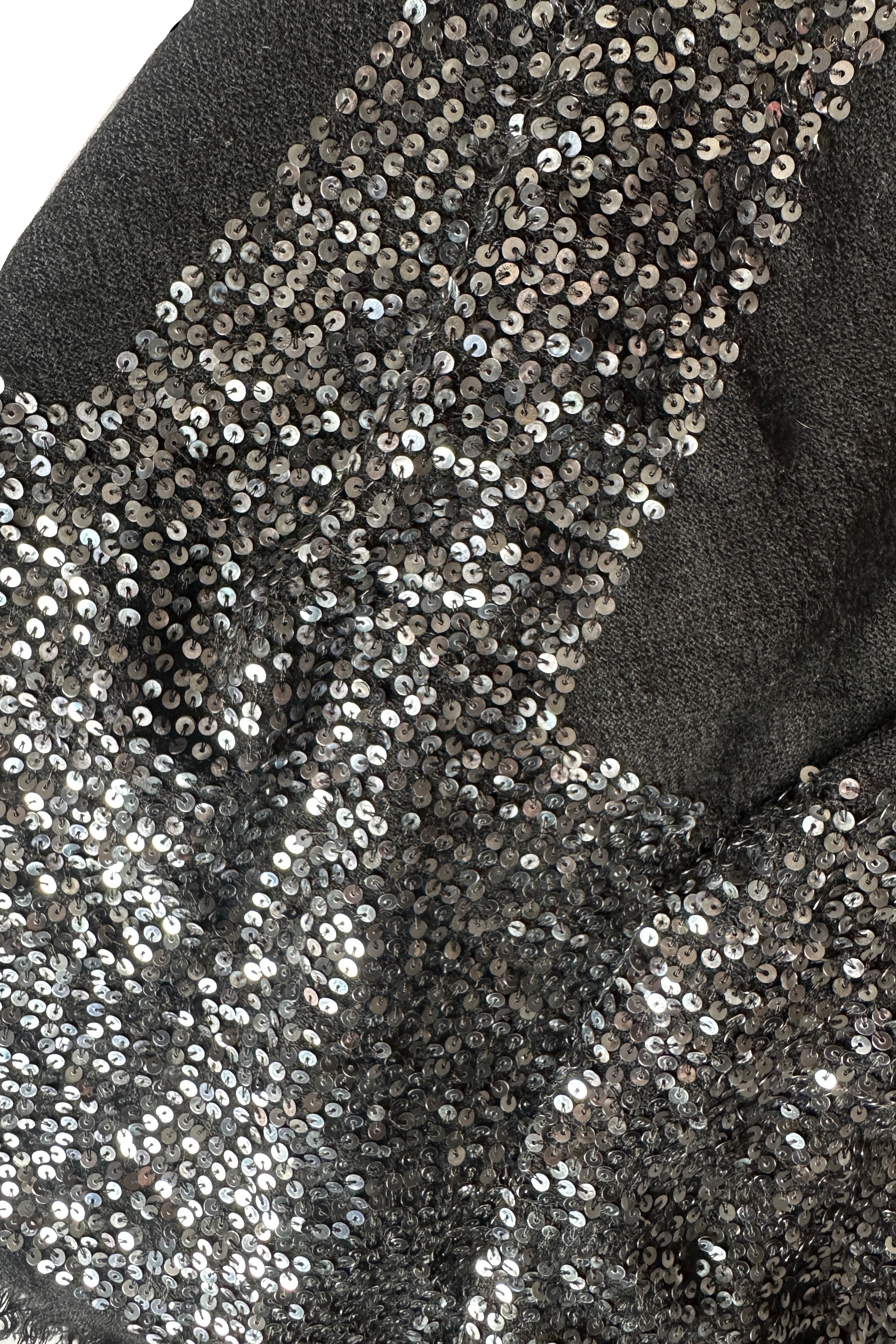 Close-up of a black glimmer scarf with silver sequin trim