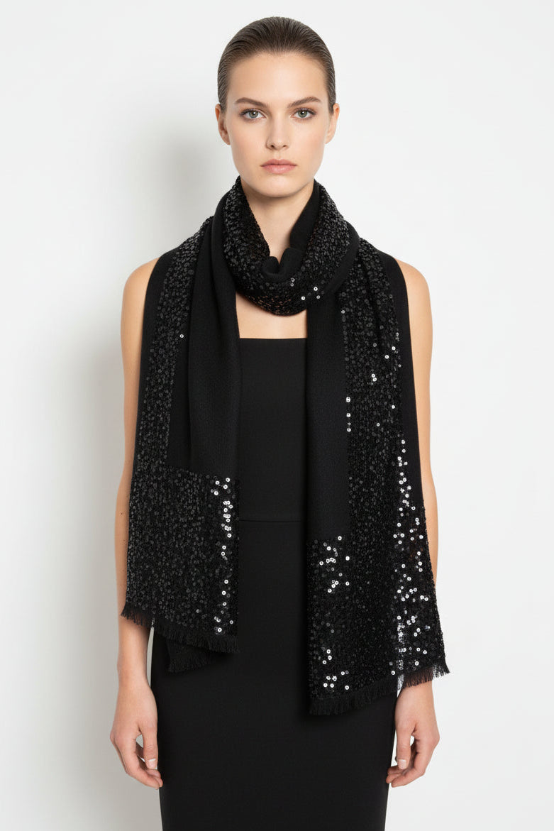 Woman wearing a black sequin scarf on a white background