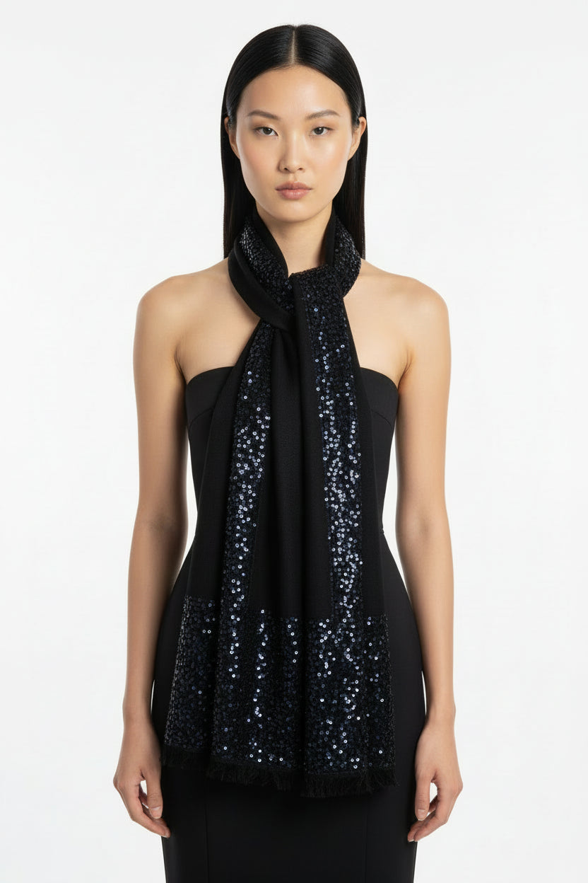 Woman wearing a black sequin scarf on a white background