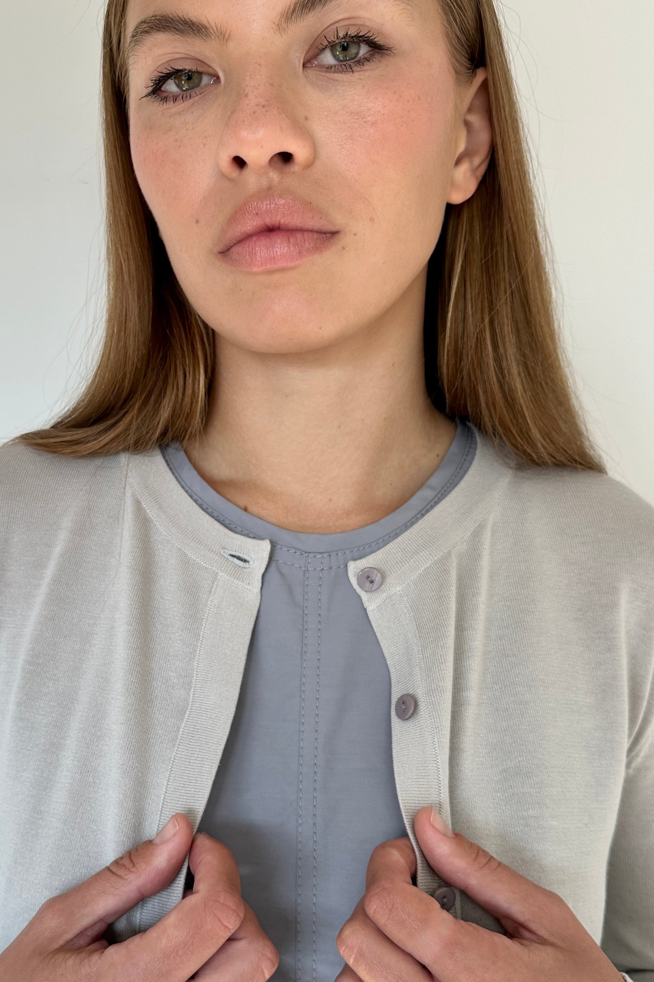 close up of grey cotton round neck cardigan