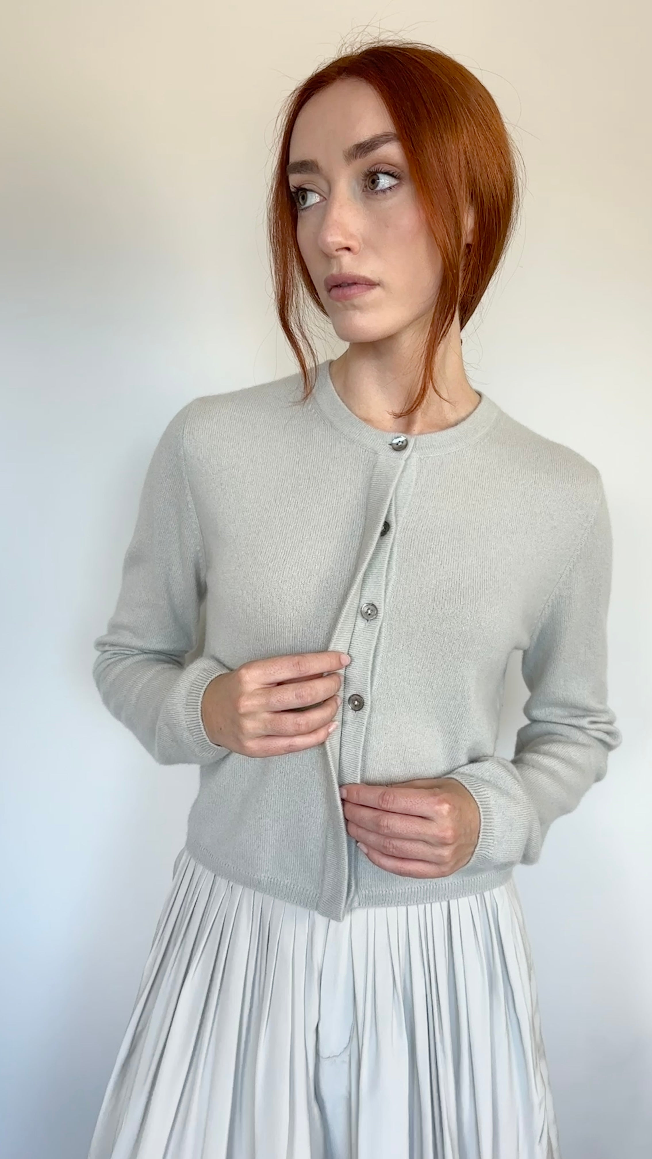 woman in grey cashmere cardigan